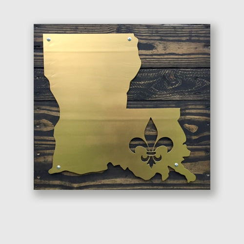Louisiana Fleur De Lis metal shape on stained wood