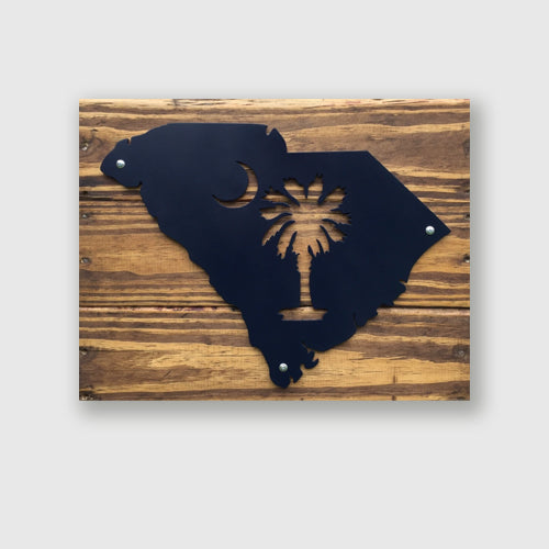 South Carolina metal sign featuring palmetto and crescent moon