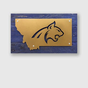Bobcat head design in metal on blue stained pallet