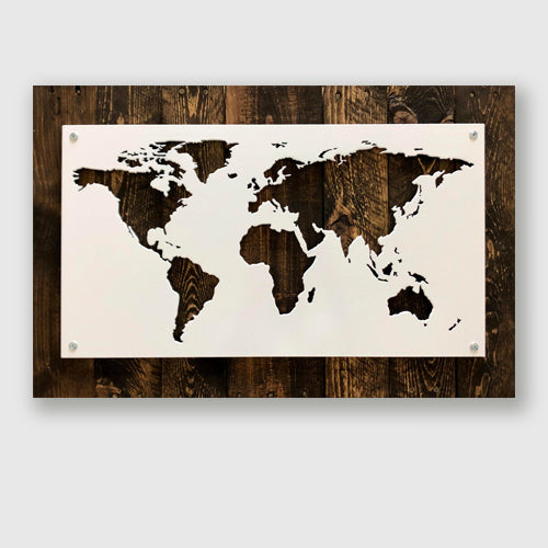 Beautiful wall art of world map cut out of metal and mounted on wood background