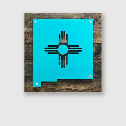 New Mexico state shape with Zia Sun in metal on upcycled wood decorative sign